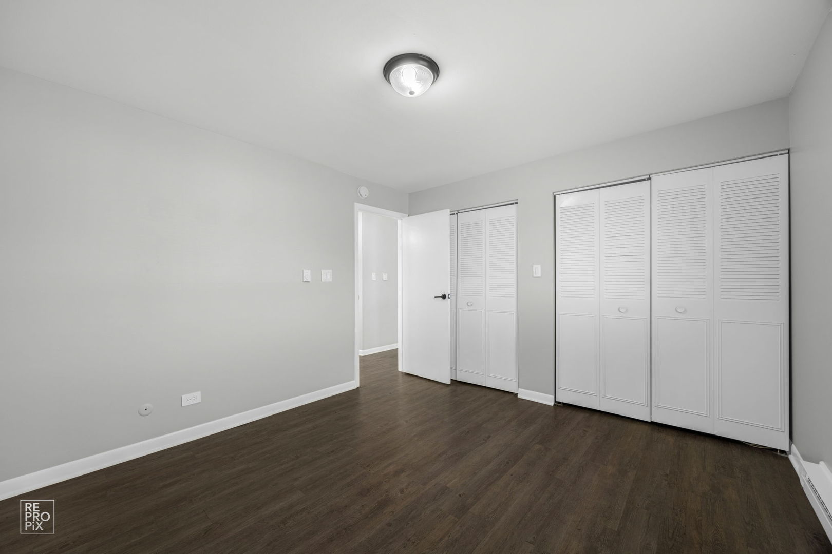 6315 Joliet Road, Unit 6 Countryside, IL 60525 - Photo 8 of 10 a view of an empty room with wooden floor
