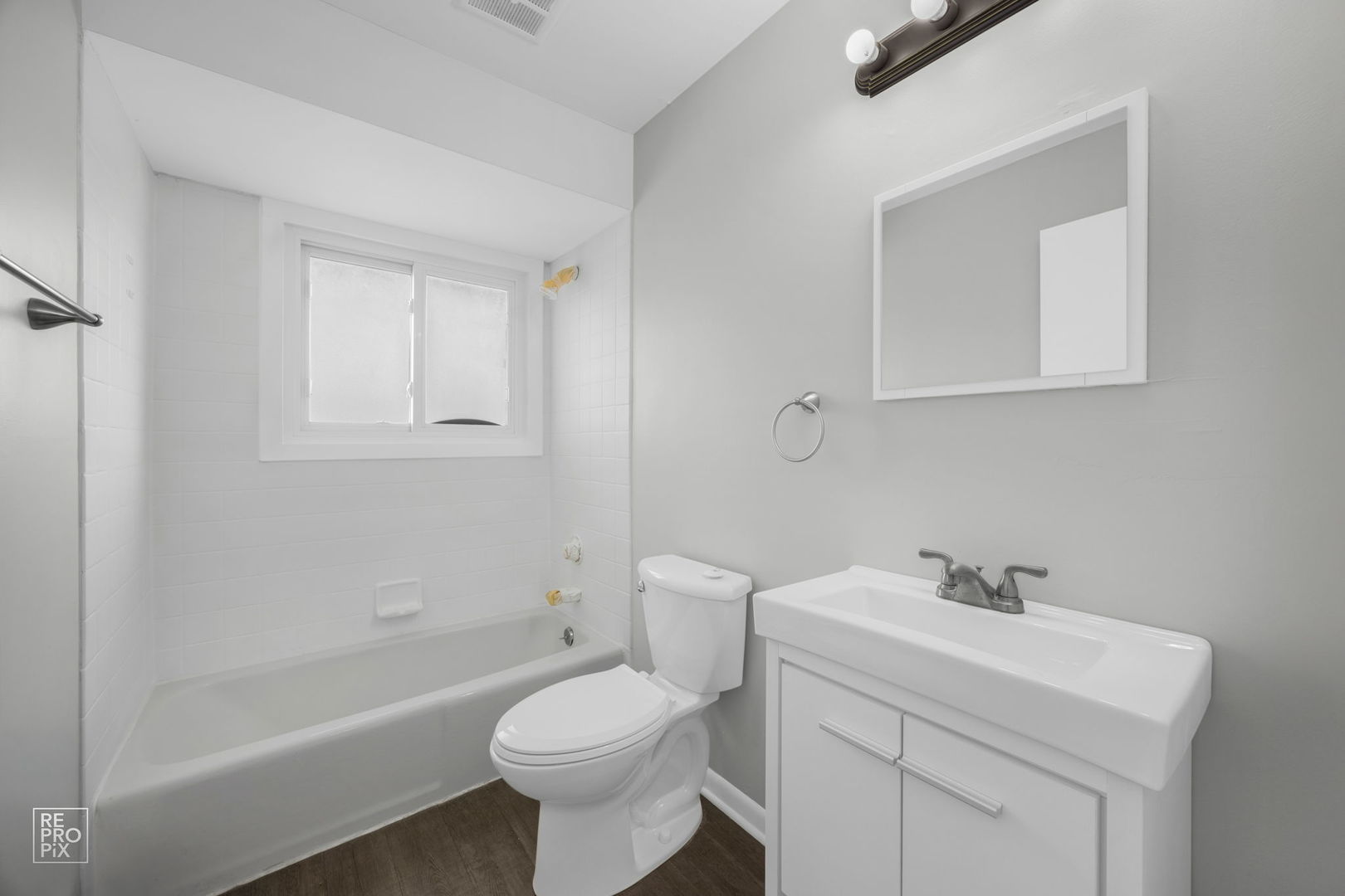 6315 Joliet Road, Unit 6 Countryside, IL 60525 - Photo 9 of 10 a bathroom with a sink toilet and vanity