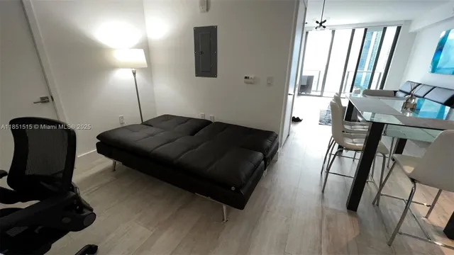 a living room with furniture rug and wooden floor
