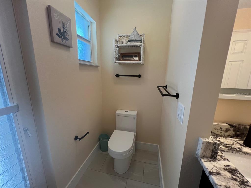 2533 Rio Tiber Drive Punta Gorda, FL 33950 - Photo 22 of 43 a bathroom with a toilet and a mirror