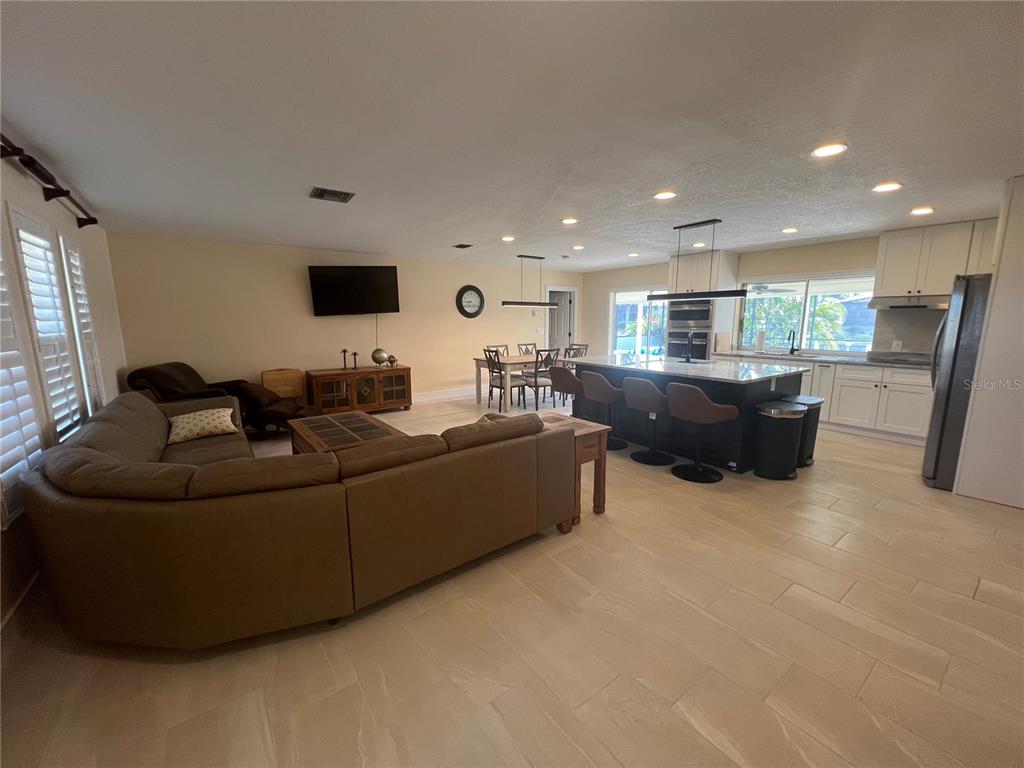 2533 Rio Tiber Drive Punta Gorda, FL 33950 - Photo 4 of 43 a living room with furniture and a flat screen tv