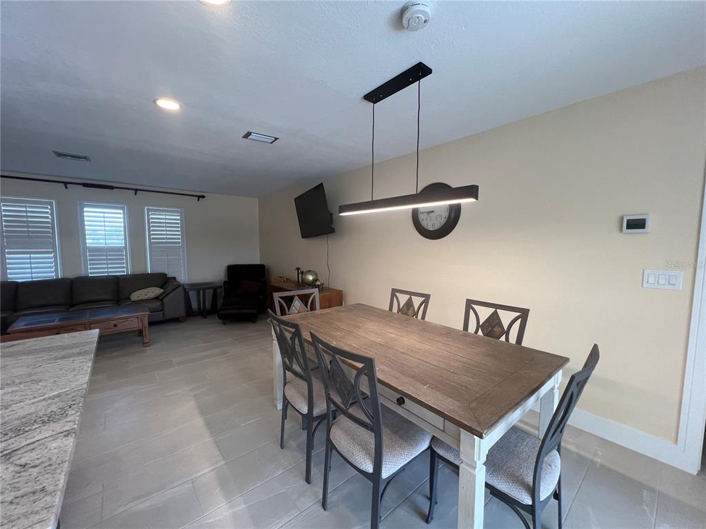 2533 Rio Tiber Drive Punta Gorda, FL 33950 - Photo 10 of 43 a view of a dining room with furniture
