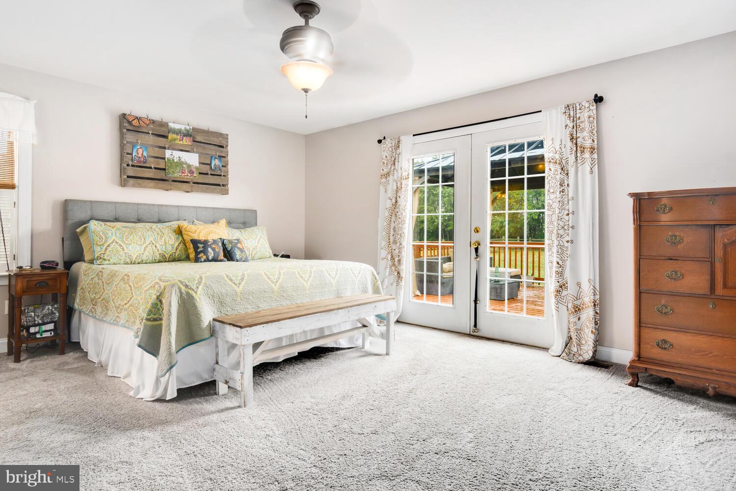 23287 Magnolia Hills Road Denton, MD 21629 - Photo 14 of 34 Primary suite with French doors to deck