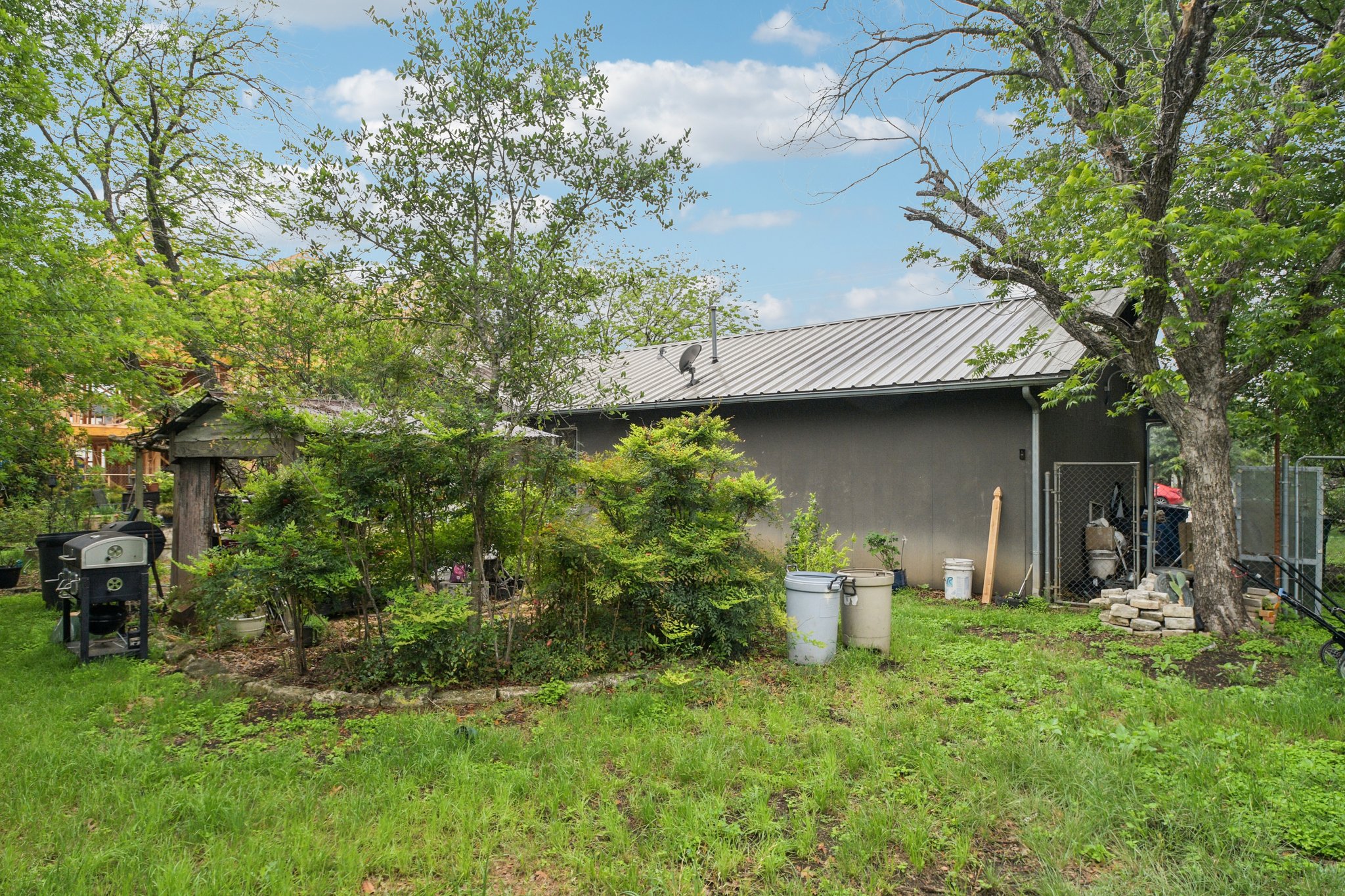 4411 Banister Lane Austin, TX 78745 - Photo 9 of 24 a view of a back yard of the house