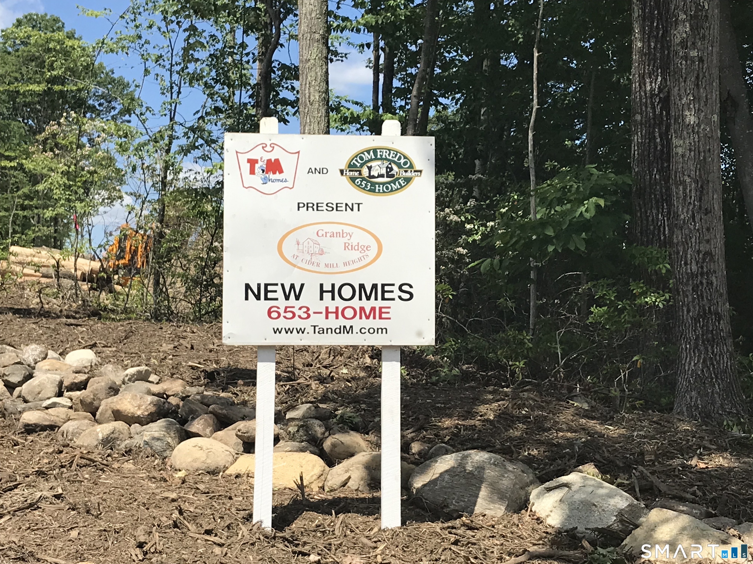609 Cider Lane Granby, CT 06060 - Photo 2 of 2 a sign that is on the side of the road