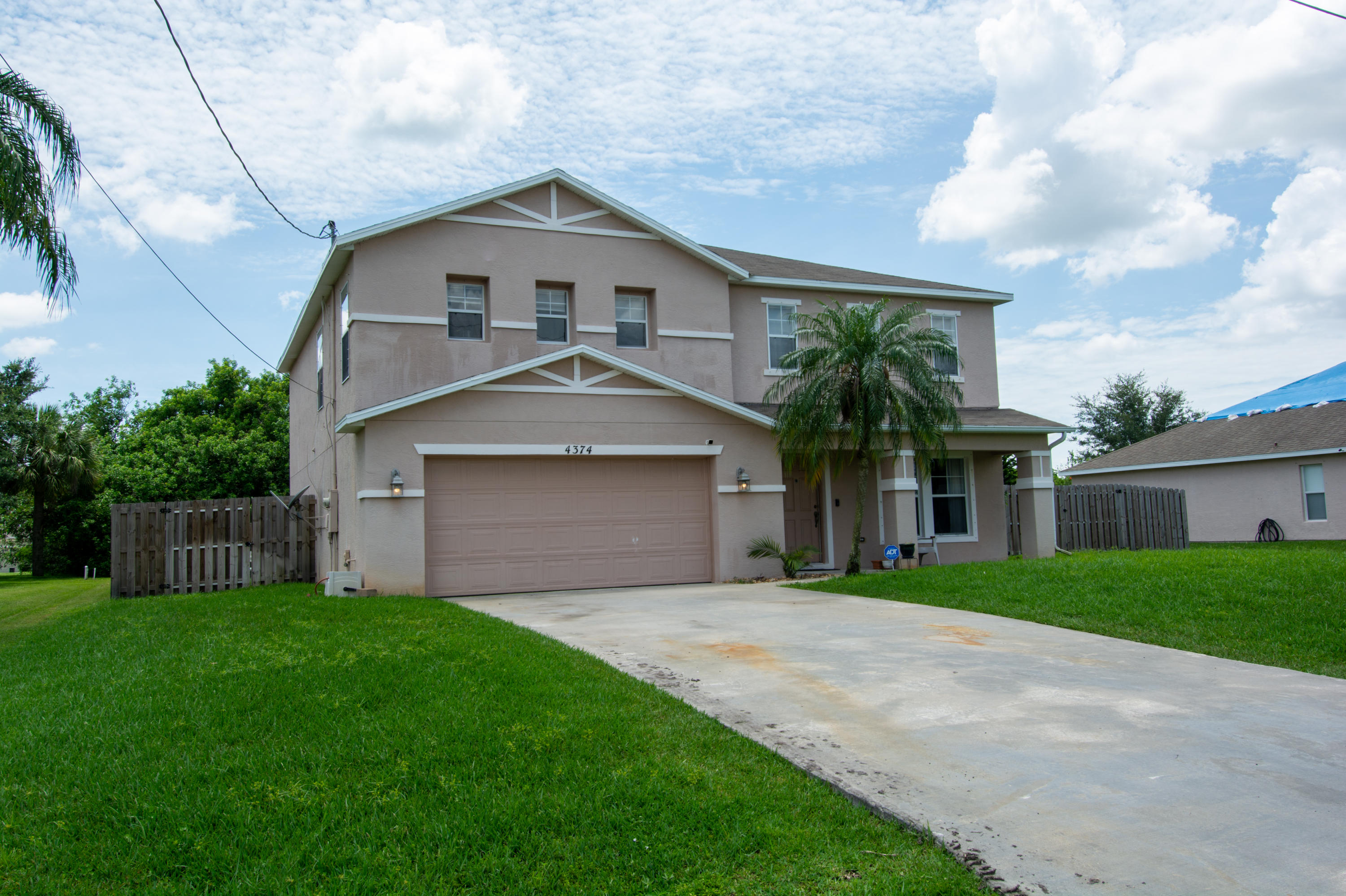 4374 Southwest Appleseed Road Port St. Lucie, FL 34953 - Photo 3 of 56 00_Curbshot 18