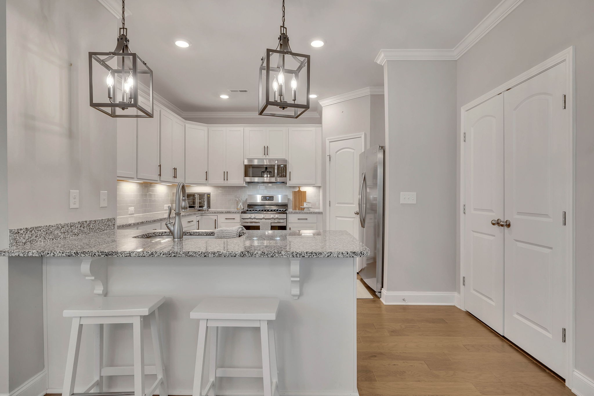 342 Buckner Cir Mount Mount Juliet, TN 37122 - Photo 12 of 40 a kitchen with stainless steel appliances granite countertop a sink refrigerator and cabinets