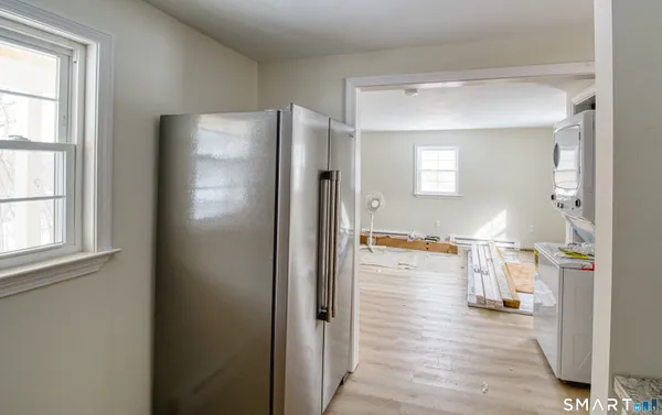 a view of a living room and a wooden floor