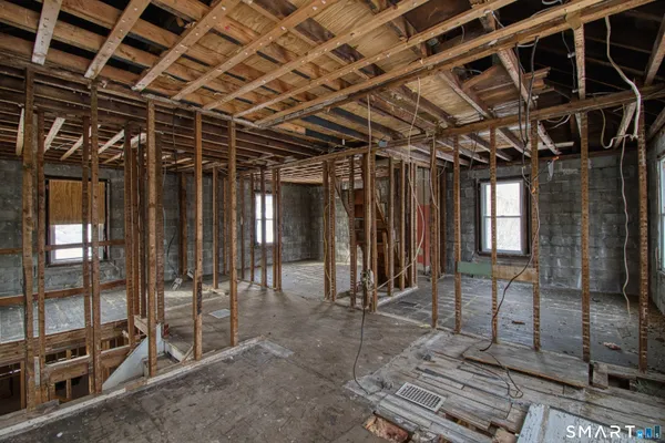 a view of an empty room with wooden frame