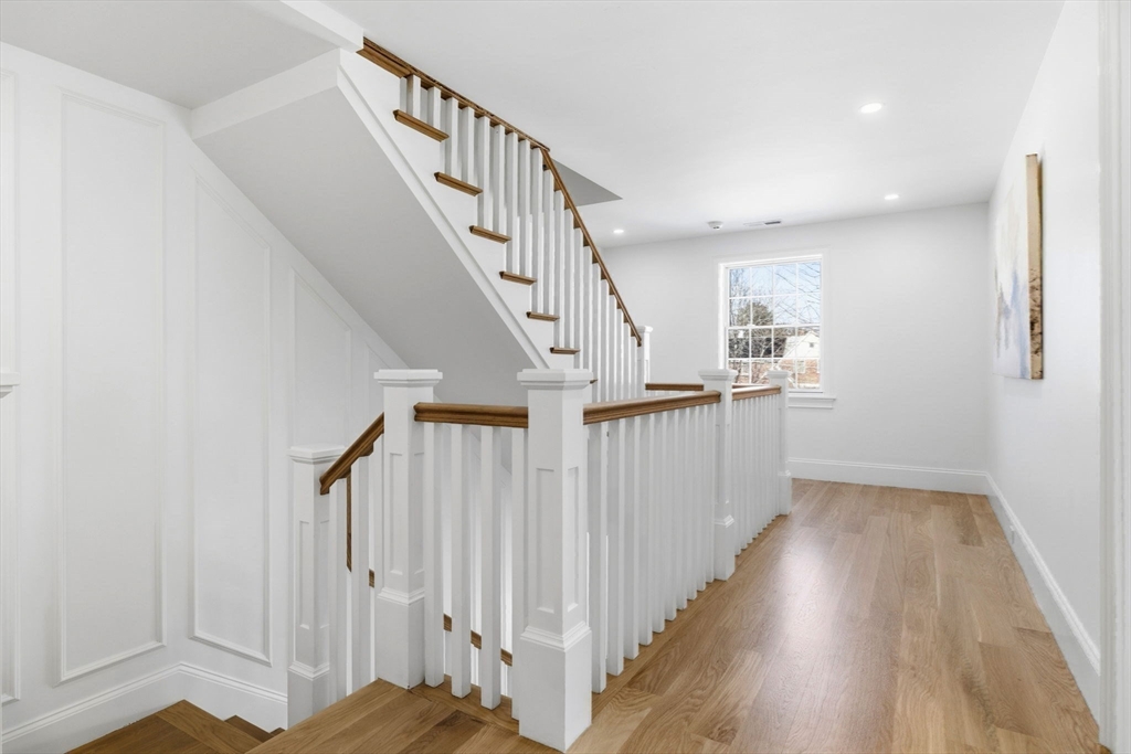 40 Foxcroft Road Winchester, MA 01890 - Photo 21 of 42 a view of a hallway with wooden floor and entryway
