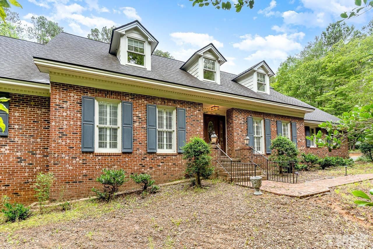 2511 Kingsley Road Raleigh, NC 27612 - Photo 1 of 50 a front view of a house with garden