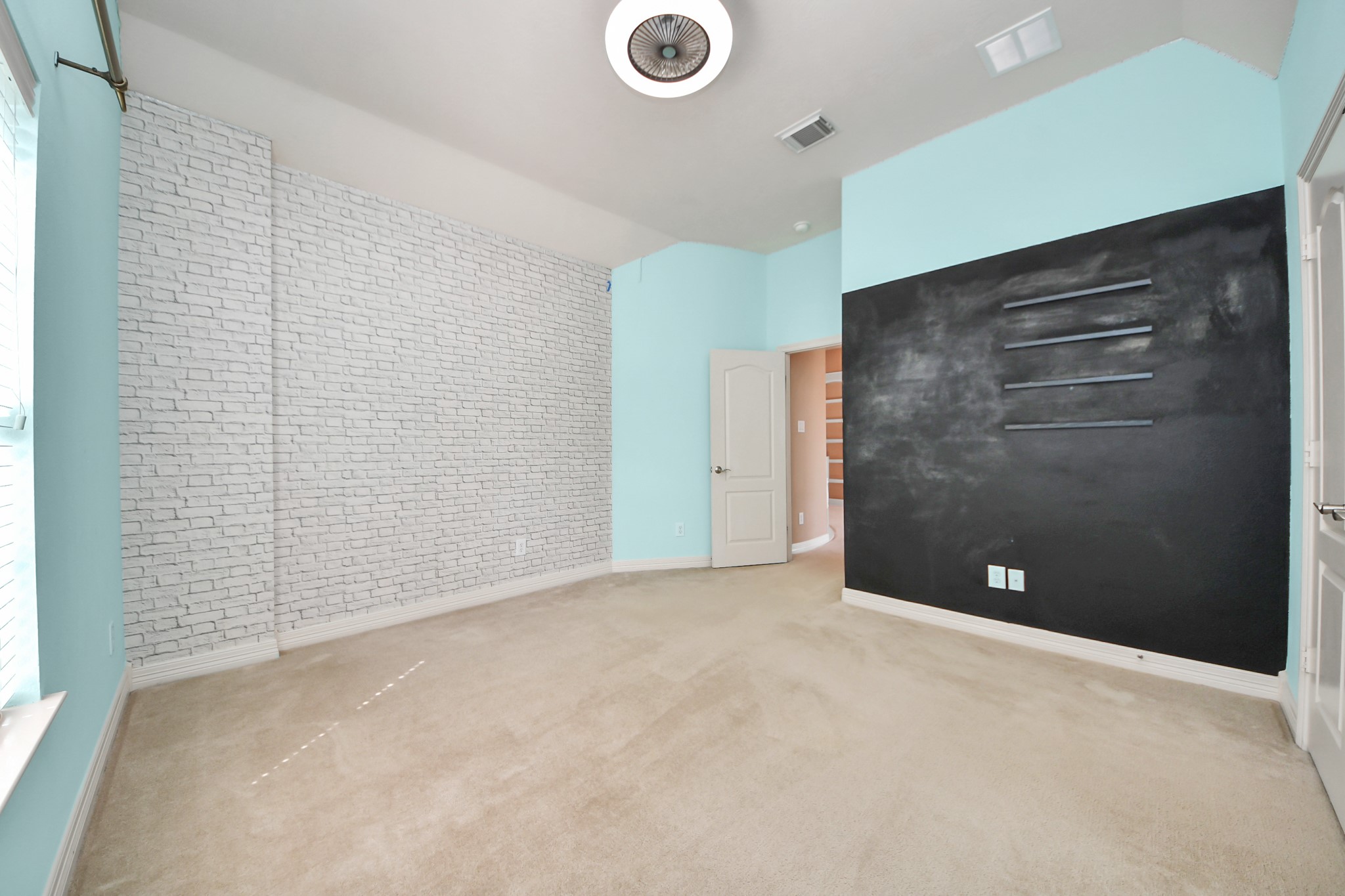 17618 Raven Canyon Lane Houston, TX 77095 - Photo 31 of 45 Cozy and colorful room with a chalkboard accent wall and stylish decor.