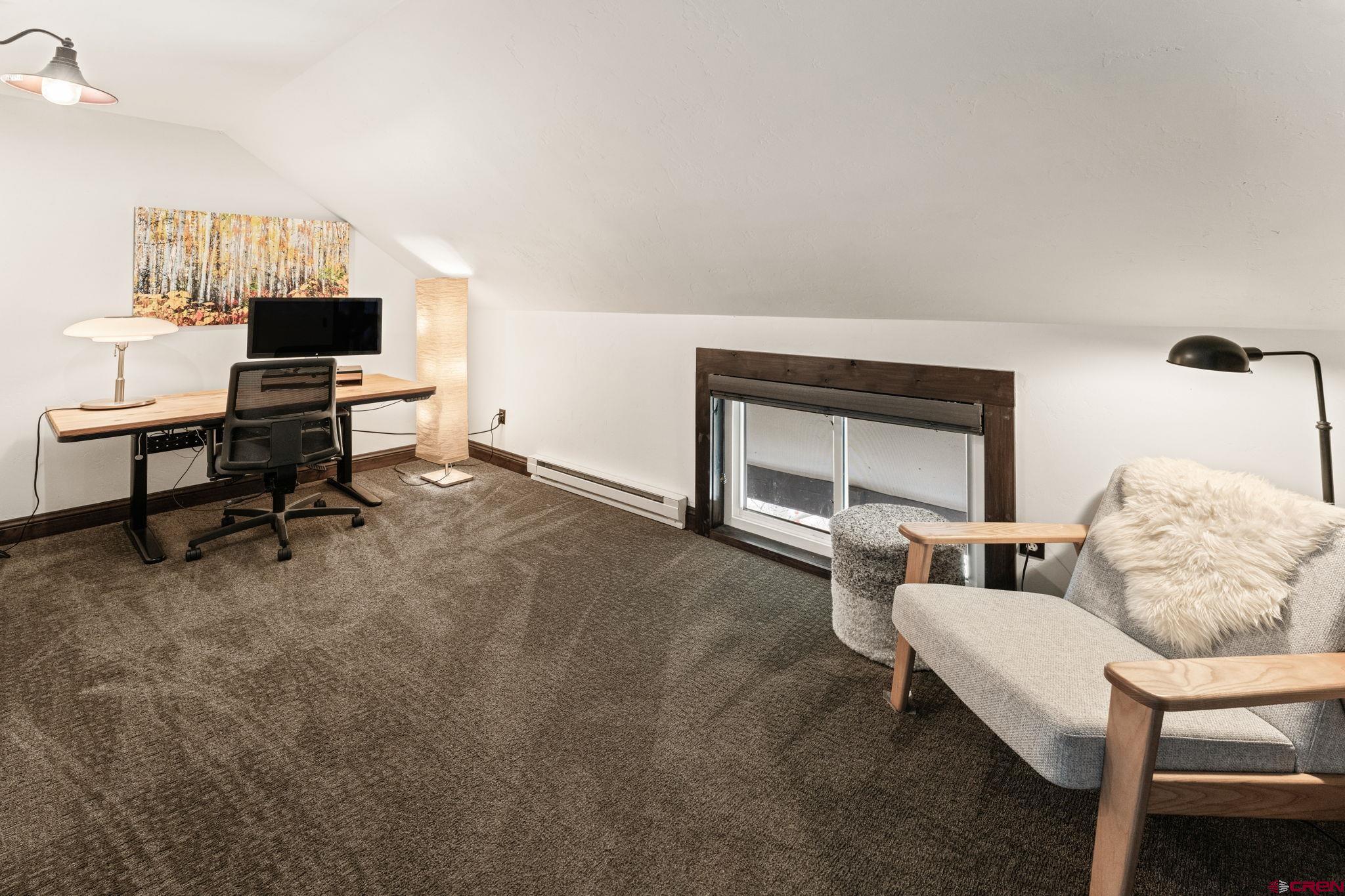 18 Crystal Road, Unit 5B Crested Butte, CO 81225 - Photo 15 of 25 a living room with furniture and a flat screen tv