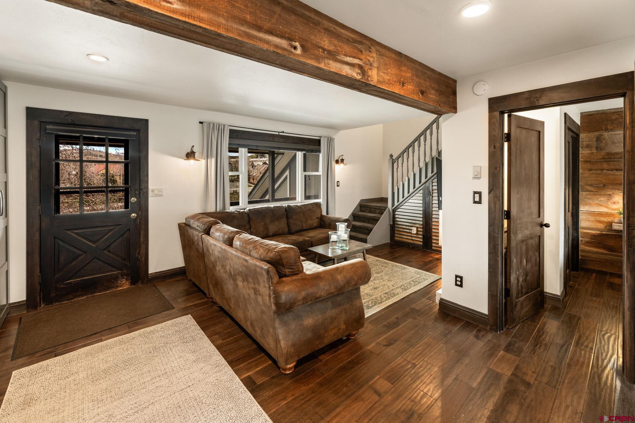 18 Crystal Road, Unit 5B Crested Butte, CO 81225 - Photo 3 of 25 a living room with furniture and a window