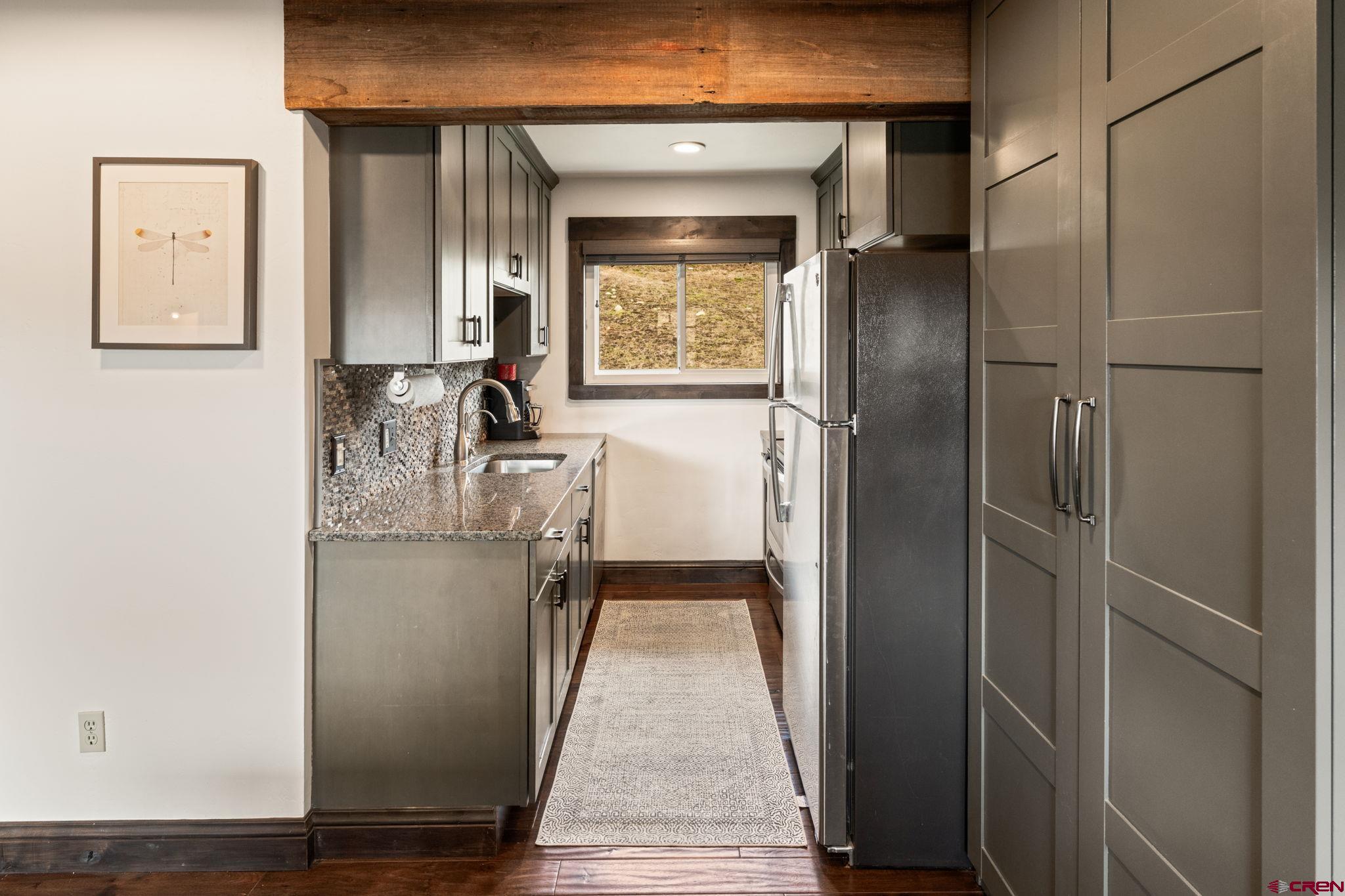 18 Crystal Road, Unit 5B Crested Butte, CO 81225 - Photo 5 of 25 a view of a hallway with wooden floor and staircase
