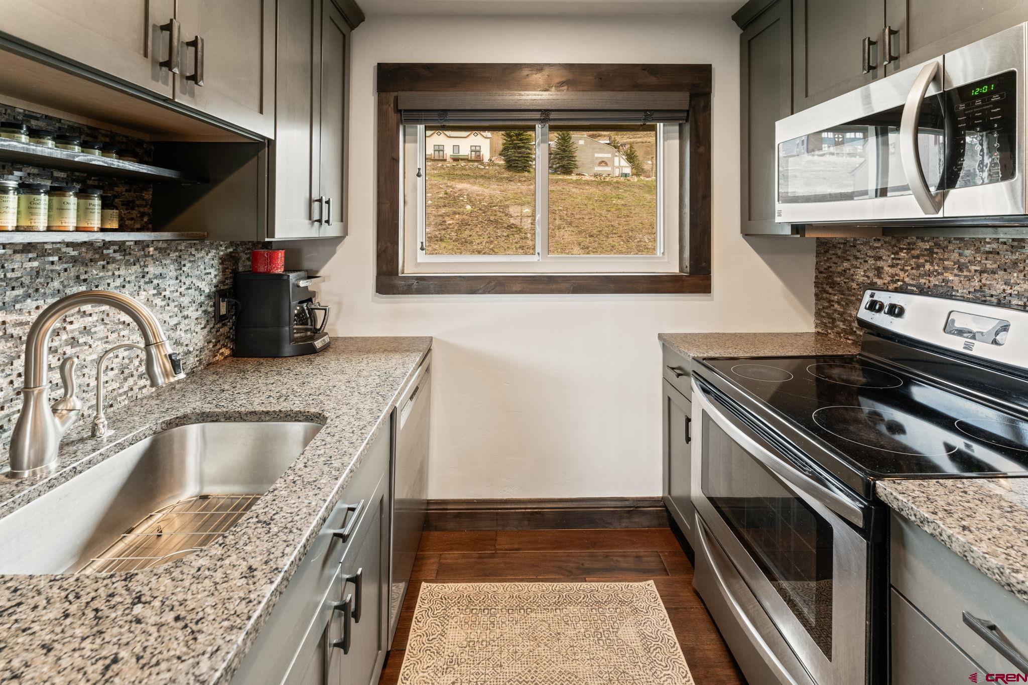 18 Crystal Road, Unit 5B Crested Butte, CO 81225 - Photo 7 of 25 a kitchen that has a sink and a stove