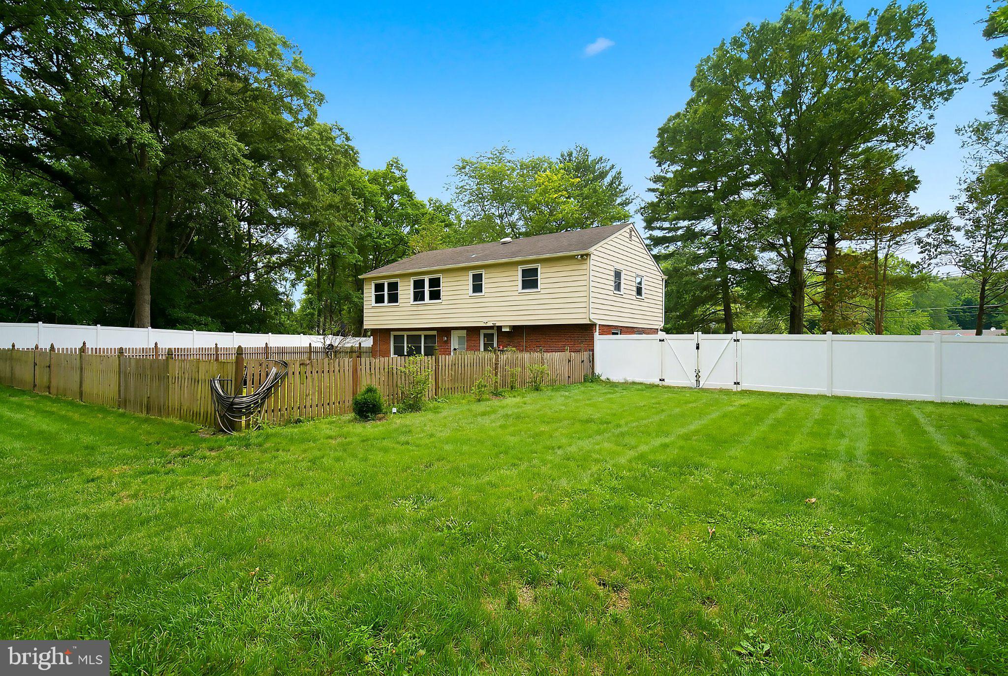 5017 Church Road Mount Laurel, NJ 08054 - Photo 26 of 37 Serene backyard oasis with lush greenery.