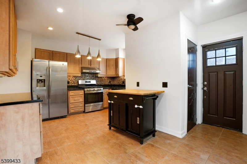 80 Locust Avenue Millburn, NJ 07041 - Photo 16 of 47 a kitchen with stainless steel appliances granite countertop a refrigerator and a sink