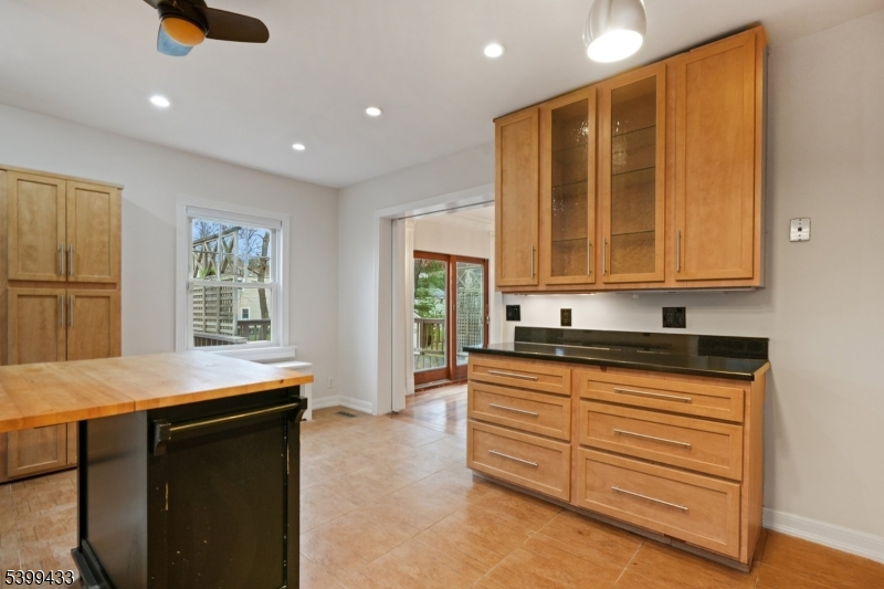 80 Locust Avenue Millburn, NJ 07041 - Photo 19 of 47 a kitchen with granite countertop cabinets and window