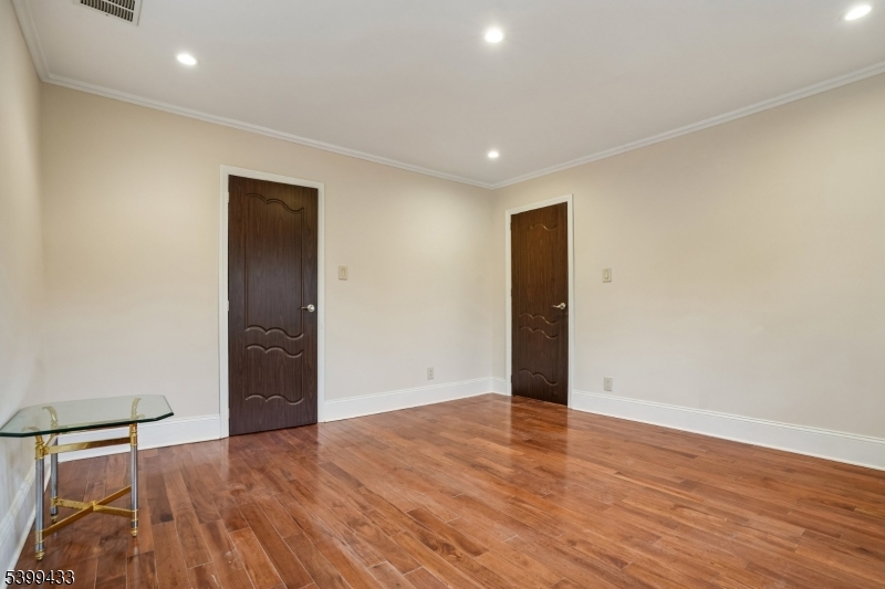 80 Locust Avenue Millburn, NJ 07041 - Photo 31 of 47 wooden floor in an empty room with a window