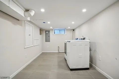 a view of a storage & utility room with a sink
