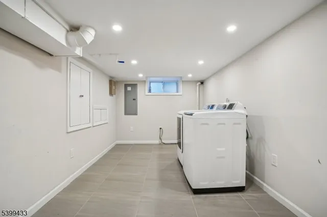 a view of a storage & utility room with a sink