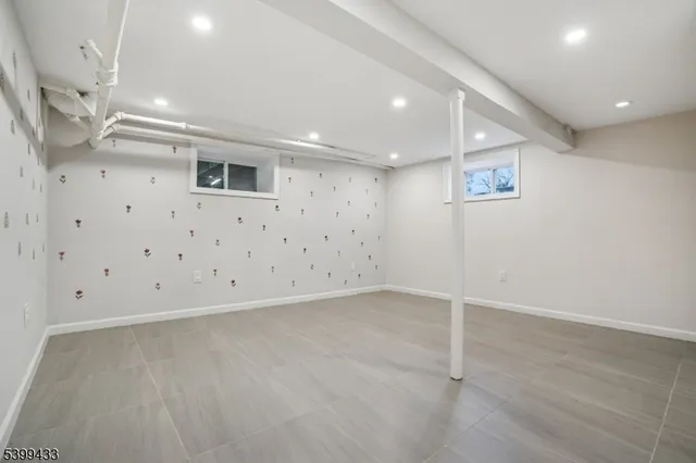 a view of an empty room with stairs