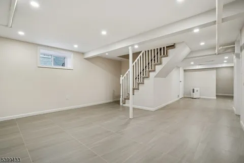 a view of an empty room with stairs