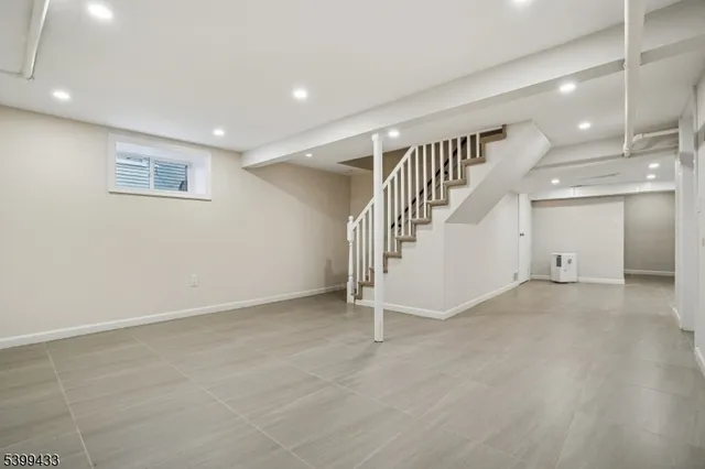 a view of an empty room with stairs