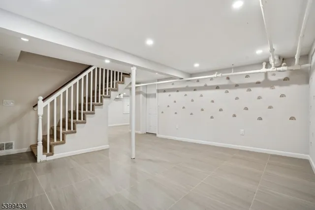 a view of a balcony with a bench and wooden floor