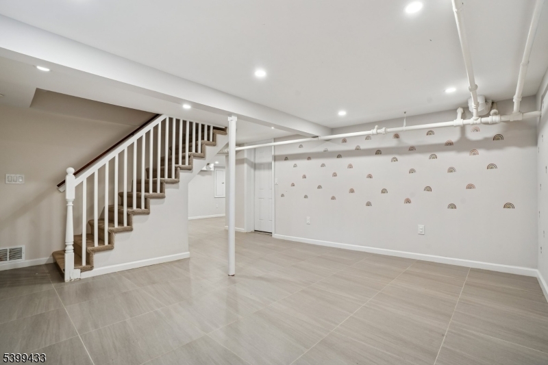 80 Locust Avenue Millburn, NJ 07041 - Photo 42 of 47 a view of an empty room with stairs