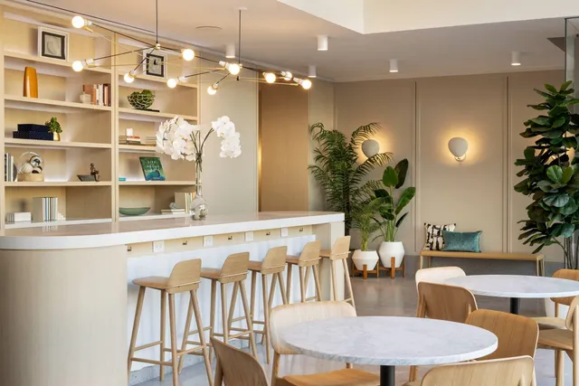 a dining room with furniture and chandelier