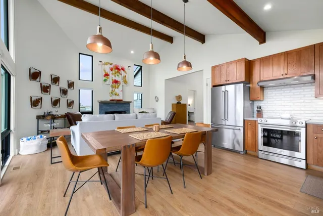 a kitchen with stainless steel appliances granite countertop a refrigerator sink and cabinets