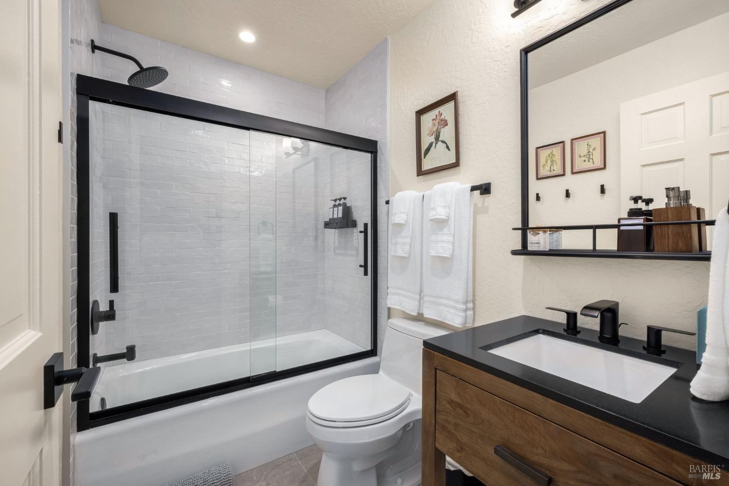 20690 Mockingbird Drive Bodega Bay, CA 94923 - Photo 23 of 51 a bathroom with a granite countertop sink toilet and shower