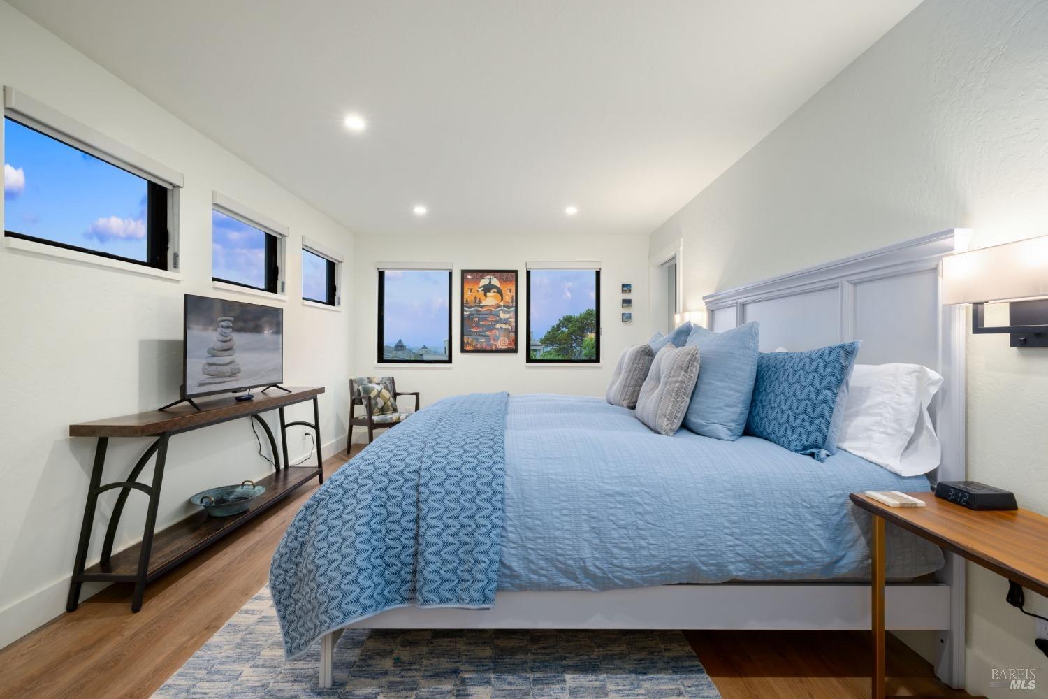 20690 Mockingbird Drive Bodega Bay, CA 94923 - Photo 25 of 51 a bedroom with a large bed and a night stand