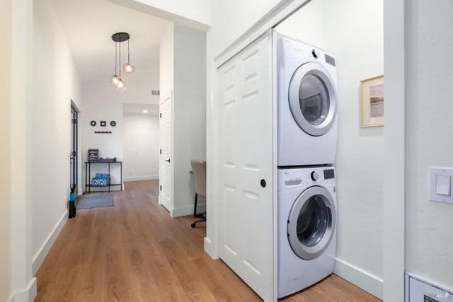 a living room with furniture fireplace and a large window