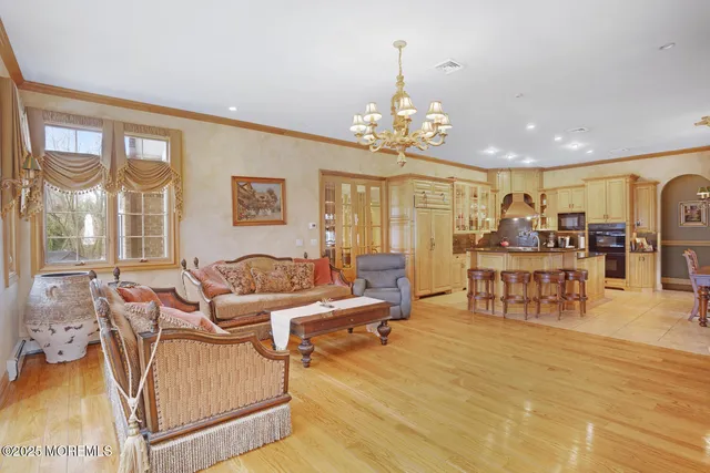 a view of living room with furniture and floor to ceiling window