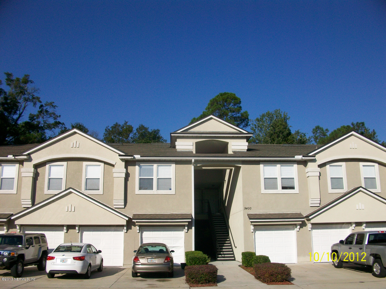 9400 Underwing Way, Unit 10 Jacksonville, FL 32257 - Photo 2 of 12 a front view of a house with cars parked