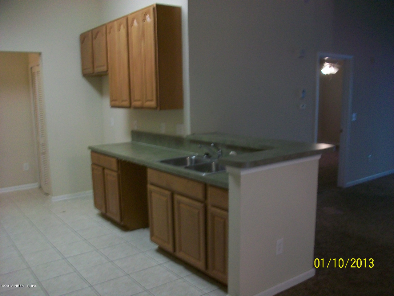 9400 Underwing Way, Unit 10 Jacksonville, FL 32257 - Photo 8 of 12 a kitchen with stainless steel appliances granite countertop a sink and a stove