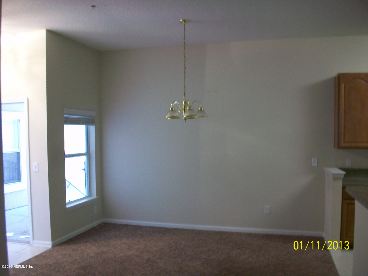 9400 Underwing Way, Unit 10 Jacksonville, FL 32257 - Photo 10 of 12 an empty room with windows