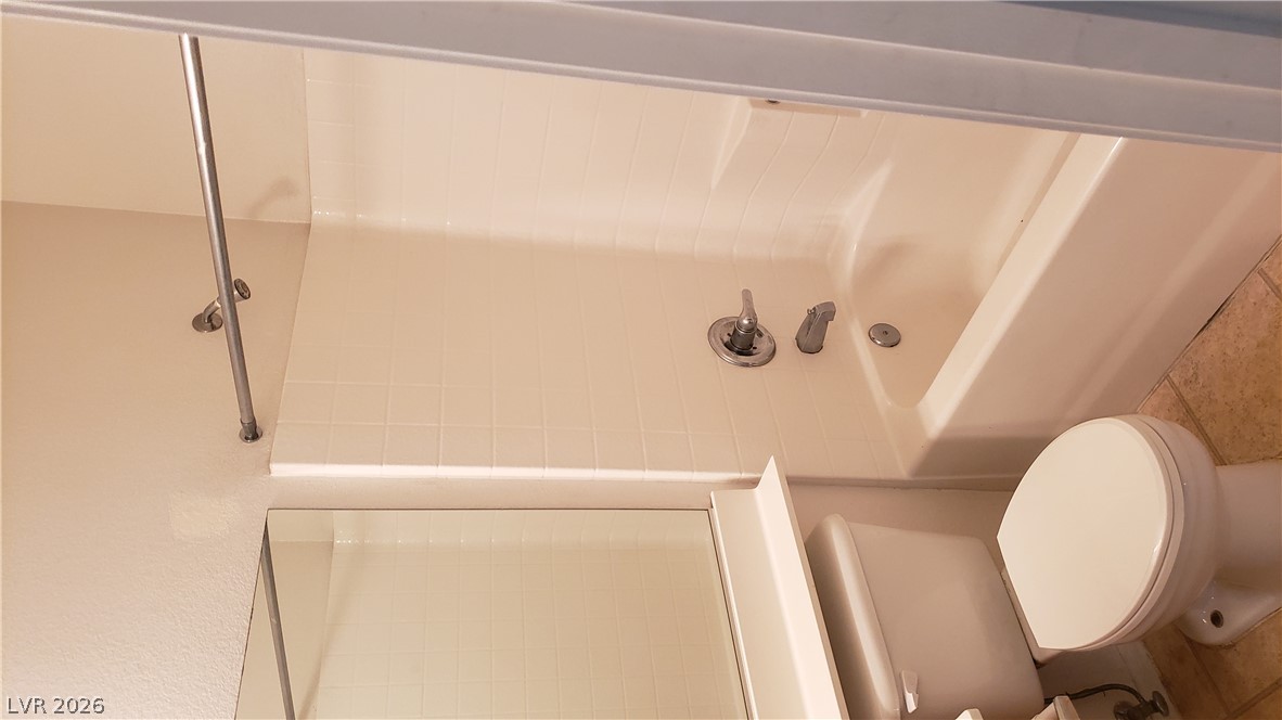 9112 Manalang Road Las Vegas, NV 89123 - Photo 45 of 50 A well-maintained full bathroom provides convenience and comfort with a shower-tub combination.
