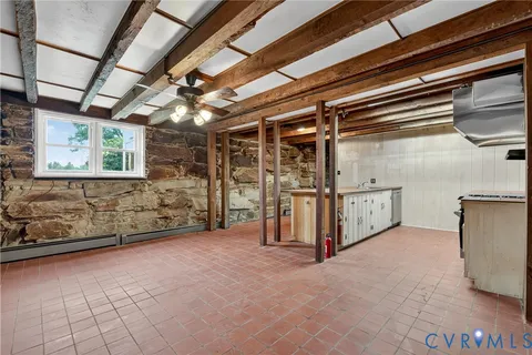 a kitchen with stove and cabinets