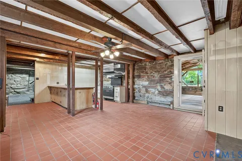 a view of empty room with fireplace