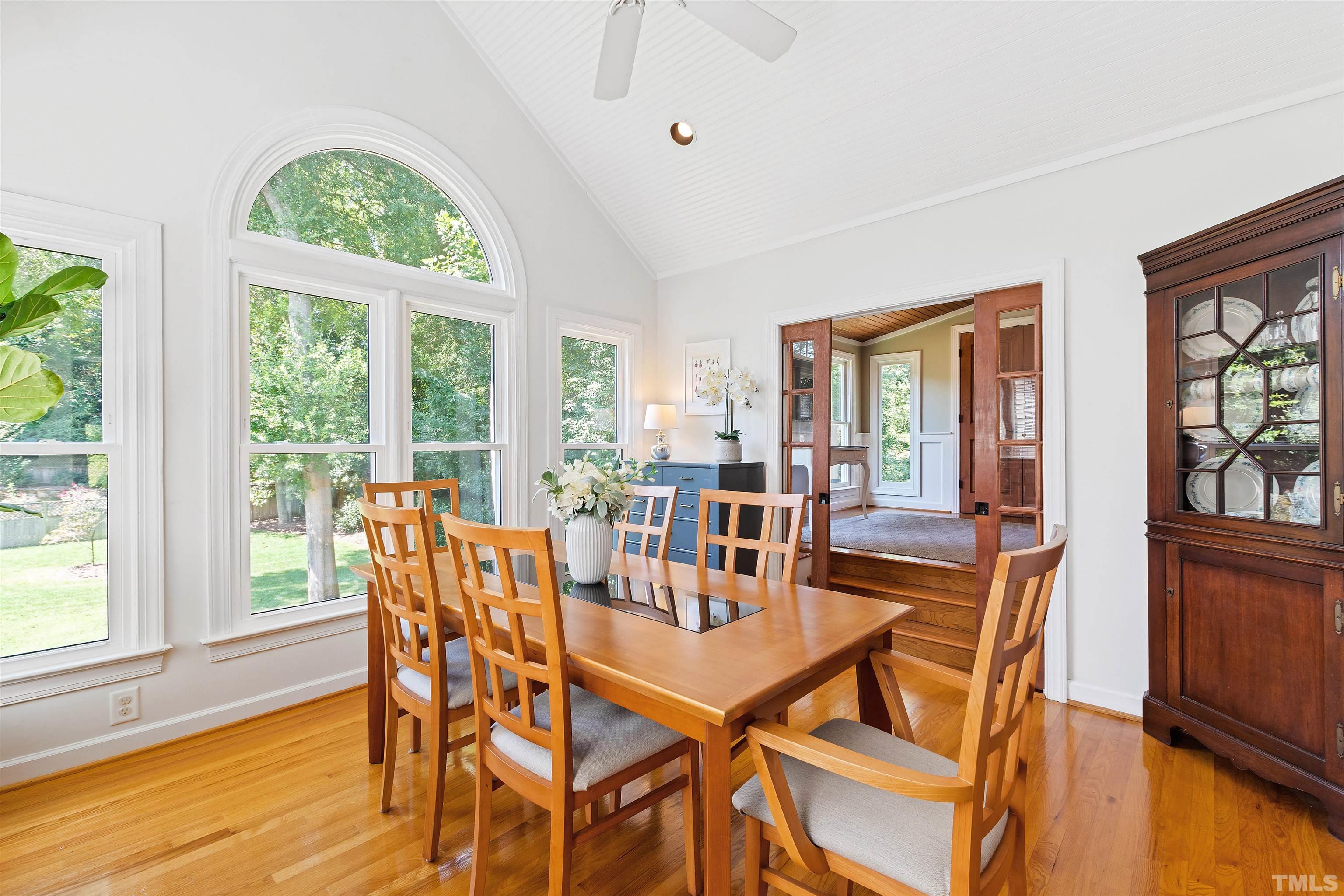 2960 Claremont Road Raleigh, NC 27608 - Photo 17 of 47 a dining room with furniture a livingroom view and wooden floor