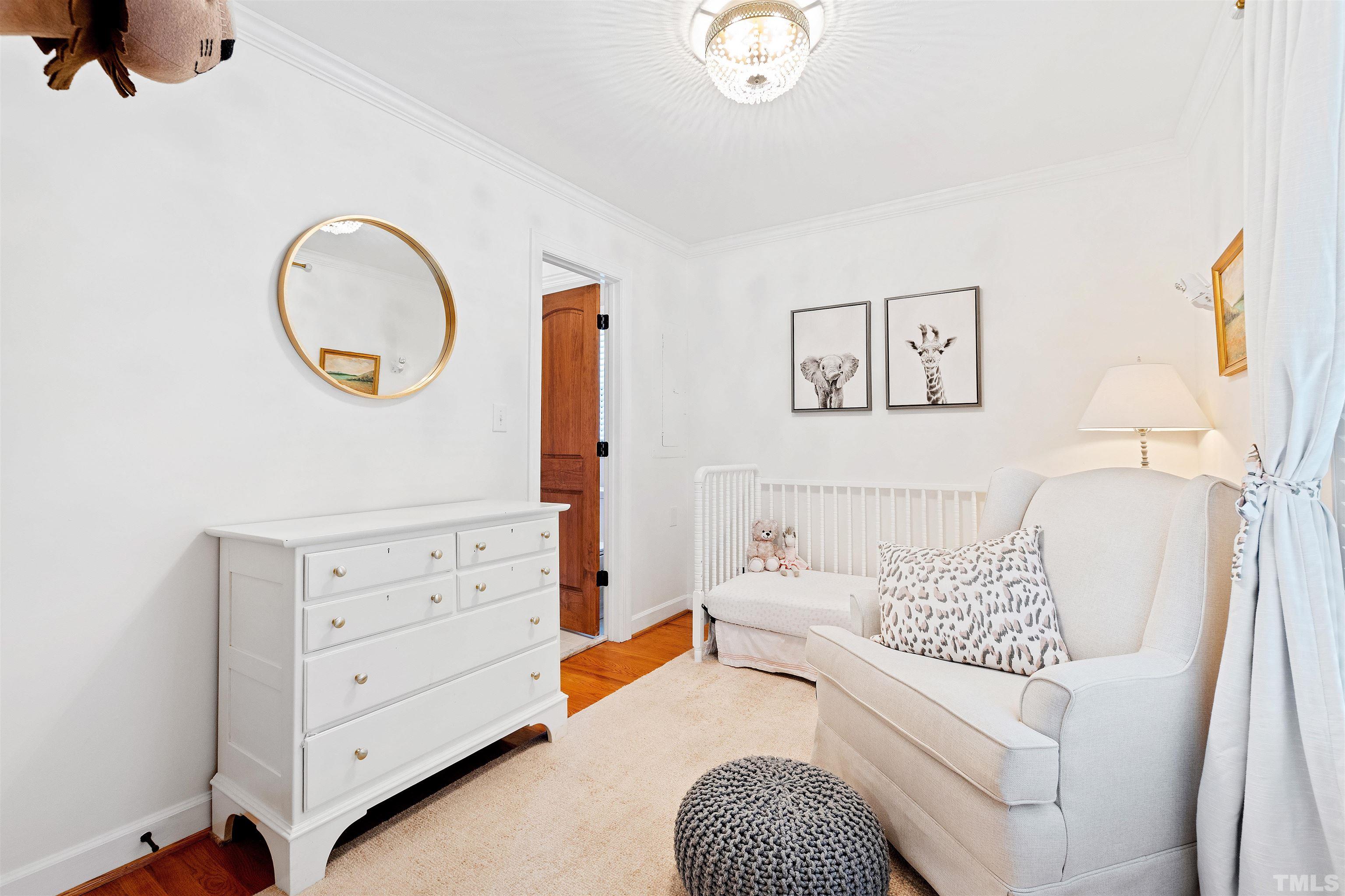 2960 Claremont Road Raleigh, NC 27608 - Photo 26 of 47 a bedroom with a bed and a dresser