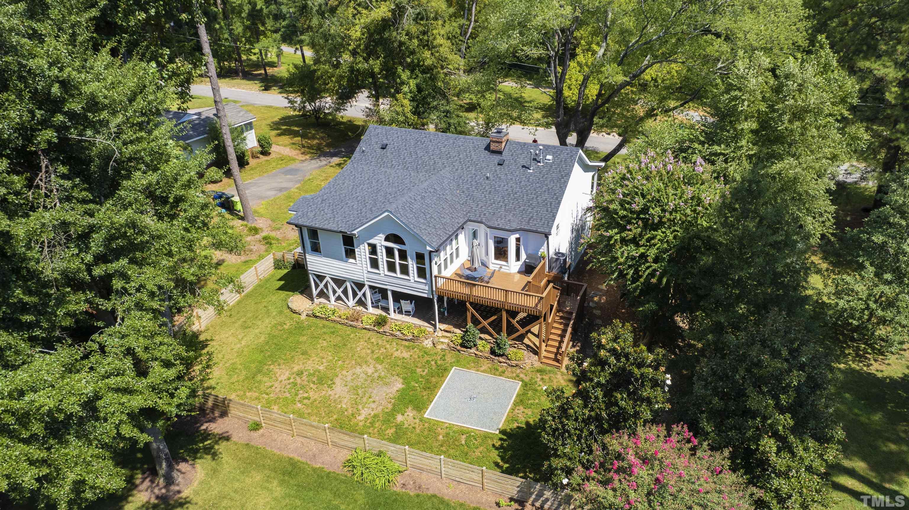 2960 Claremont Road Raleigh, NC 27608 - Photo 44 of 47 an aerial view of a house with swimming pool and large trees