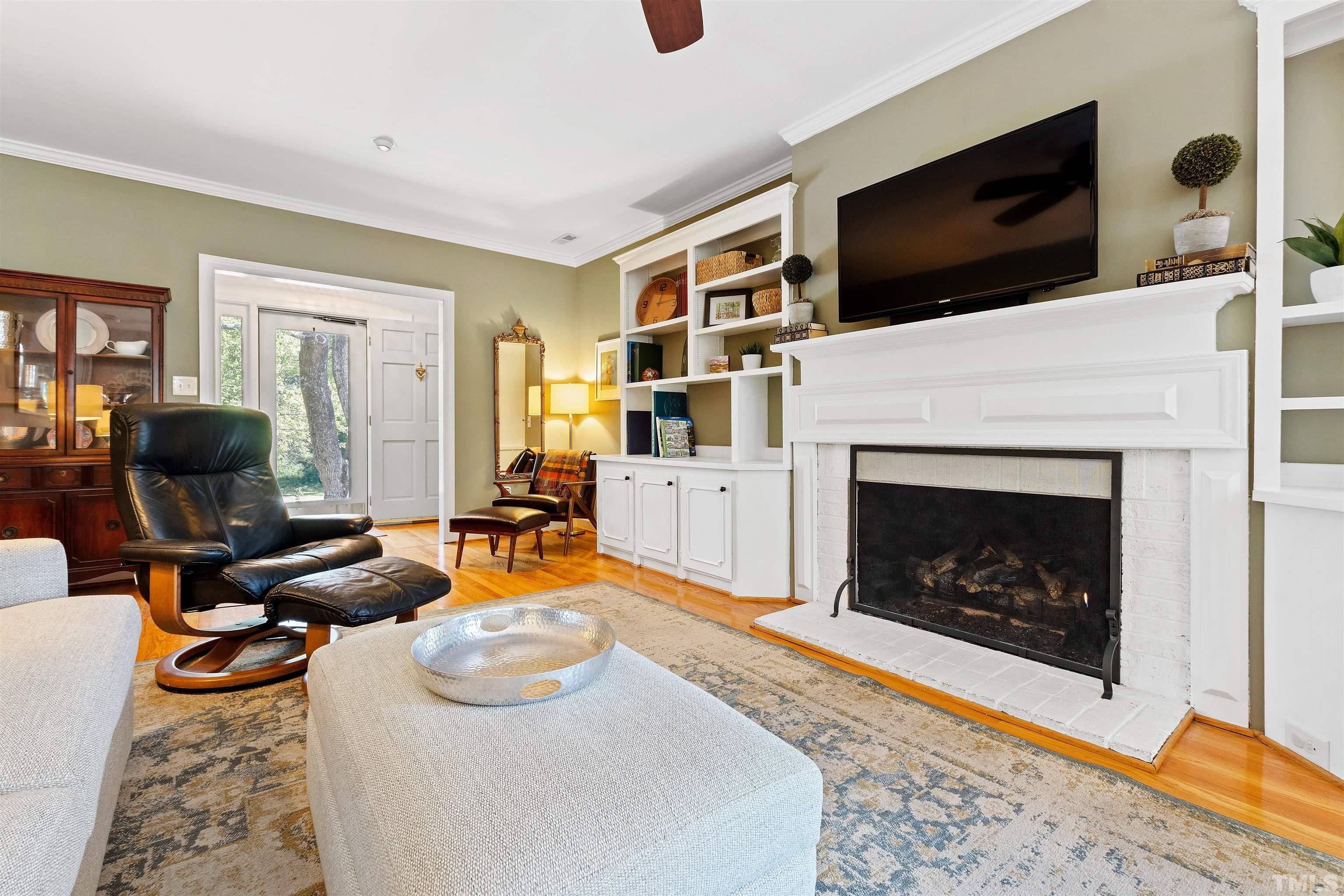 2960 Claremont Road Raleigh, NC 27608 - Photo 8 of 47 a living room with furniture and a fireplace