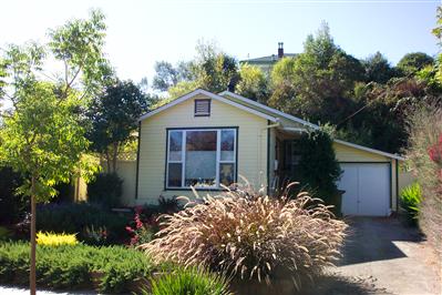 104 Clayton Street San Rafael, CA 94901 - Photo 1 of 5 a front view of house with yard and trees around