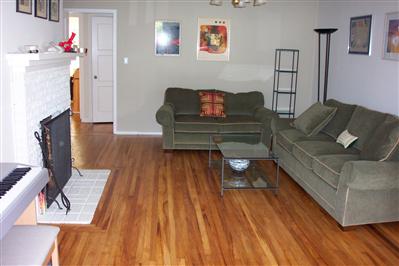 104 Clayton Street San Rafael, CA 94901 - Photo 2 of 5 a living room with furniture and a wooden floor