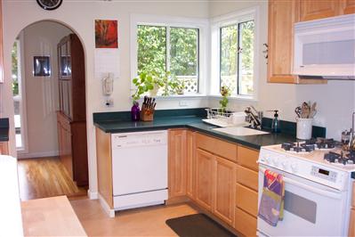 104 Clayton Street San Rafael, CA 94901 - Photo 4 of 5 a kitchen with a sink cabinets and window